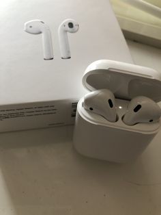 an apple airpods sitting on top of a box