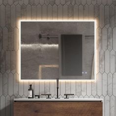 a bathroom with a sink, mirror and faucet in the middle of it