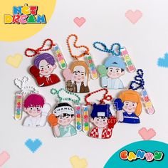 various keychains with cartoon characters on them and hearts in the shape of heart shapes