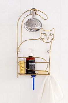 a bathroom shelf with a shower head and soap dispenser attached to it