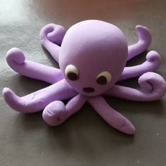 an octopus stuffed animal sitting on top of a table