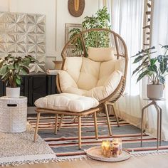 a living room filled with furniture and plants