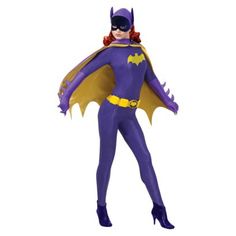 a woman dressed in purple and yellow is standing with her hands on her hips while wearing a batgirl costume