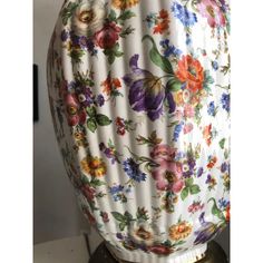 an image of a lamp with flowers on it