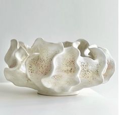 a white bowl sitting on top of a table