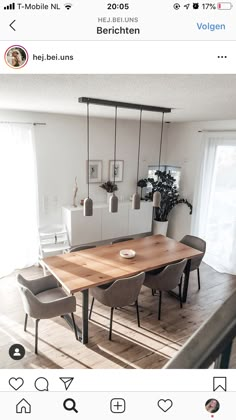 a dining room table and chairs in front of a sliding glass door