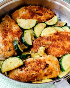 chicken with zucchini and squash in a pan