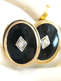 Vintage heirloom quality solid yellow gold, black onyx and diamond cufflinks: ~ Perfect, classy, timeless and totally unisex ~ Feature iconic bezel set polished black onyx ovals ~ White gold diamond shaped centerpiece set with a genuine diamond accent - adds the perfect amount of class and sparkle.  The gems are open back set for maximum dazzle ~ Solid 10k yellow gold  ~ These are very versatile and are bound to get worn again and again - from dressing up your favorite denim or jeans outfit to wearing with a tuxedo or suit on the most special days of your life Ready and waiting for your sleeve, special outfit or day, jewelry wardrobe, collection, or gift giving - you will love these! AGE OR ERA:  Original true authentic antique / vintage piece  - this particular mark was used as early as 1 Gold Cuff Links, Diamond Cufflinks, Onyx Cufflinks, Diamond Centerpiece, Diamond Cufflink, Jewelry Wardrobe, Gold Cufflinks, Black Onyx Stone, Diamond Shaped