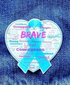 a heart shaped badge with the words brave on it