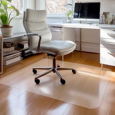 an office chair sitting in front of a computer desk