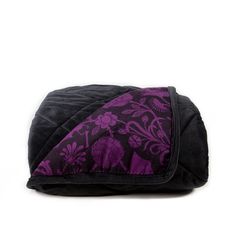 a black and purple bag with an elephant on it's side, sitting against a white background