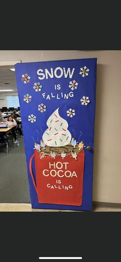 a sign that says snow is falling, not cocoa is calling in front of a classroom