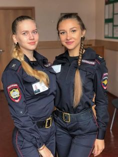 two female police officers standing next to each other