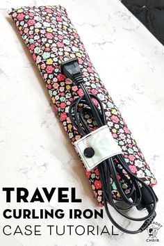 an electronic device is plugged into a flowered case with the words travel curling iron case