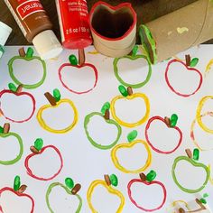 an apple craft is shown with glue and paper