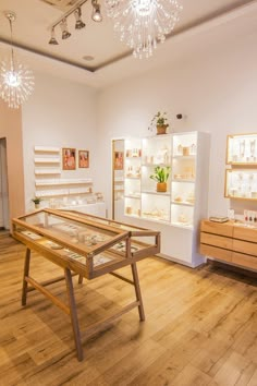 the inside of a jewelry store with wooden floors