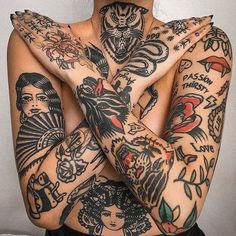 a woman with tattoos covering her face and arms