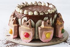 a cake with chocolate frosting and candy decorations