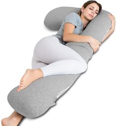 a woman is laying down on an inflatable pillow with her arms folded out