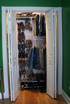 an open closet filled with shoes and other items