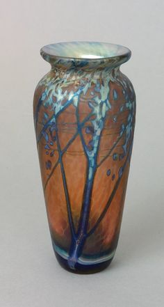 a vase with blue and orange designs on it