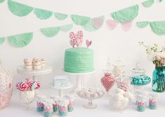 a table topped with lots of candy and cakes