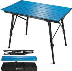 an outdoor table with blue cover and black straps on the bottom, next to it's carrying bag