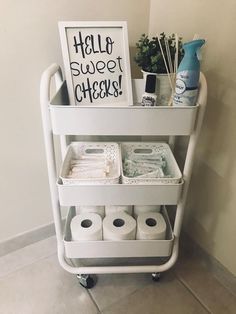 a cart with toilet paper and other items on it