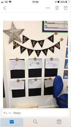 an office cubicle decorated with black and white paper, gold stars and pennants