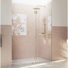 a walk in shower sitting next to a tiled wall