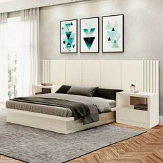 a bed room with a neatly made bed and two pictures on the wall