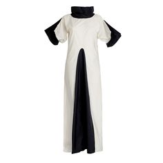 This is a dress both modest and spectacular. It has very volumetric sleeves, it creates space around you, you are making an appearance in it, but it doesn't show nor body shape nor skin. It has a round very high collar in contrast black. this dress is made of 100% polyester. It needs dry cleaning.