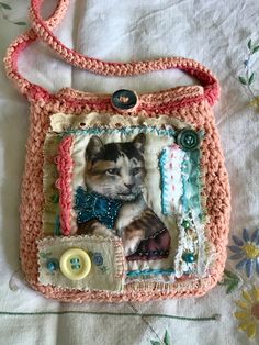 a small purse with a cat on it