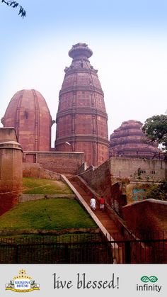 an old building with two domes on top and stairs leading up to the entrance way