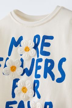 FLORAL PRINT TOP T-shirt Floral, Trendy White Zara T-shirt, Zara Summer T-shirt With Text Print, Trendy Blue T-shirt With Embroidered Graphics, Summer Short Sleeve T-shirt With Embroidered Text, Blue T-shirt With Embroidered Text For Spring, Zara T-shirt With Letter Print For Spring, Blue Tops With Embroidered Text For Spring, Cute Spring Letter Print T-shirt