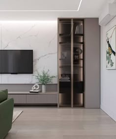 a living room filled with furniture and a flat screen tv mounted on the wall above it