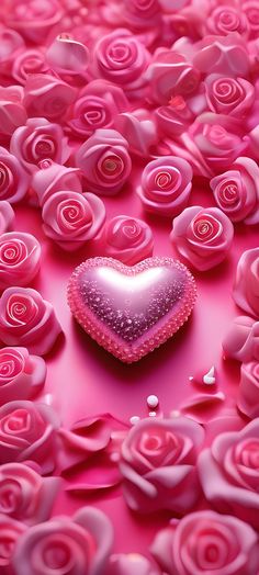 a heart shaped object surrounded by pink roses