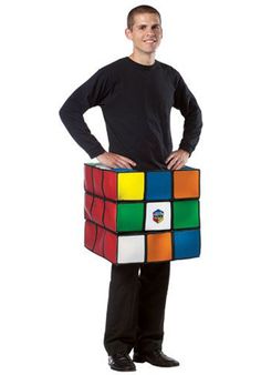 a man is holding a rubik cube in his hands and posing for the camera