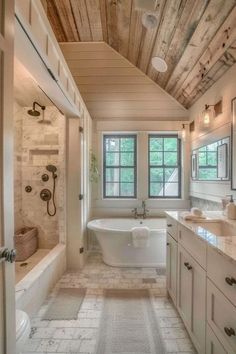 a large bathroom with two sinks and a bathtub