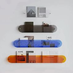 three skateboards mounted to the side of a wall