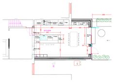 an architectural drawing shows the floor plan for a kitchen and living room, with stairs leading up to the second floor