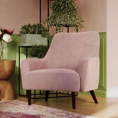 a pink chair sitting in front of a green wall with potted plants on it