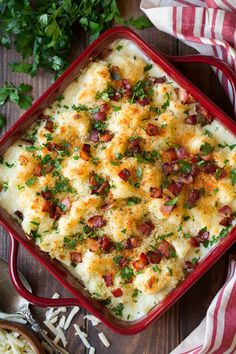 a casserole dish with cheese, bacon and parsley