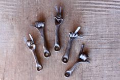 four wrenches are arranged on a wooden surface