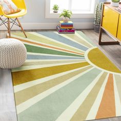 a brightly colored area rug in a living room