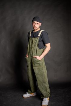 High quality cotton olive green denim baggy overall for men & women, heavy weight durable cotton fabric, although breathable and comfortable to wear all day. Wear it at work or even as your street wear clothes, cause it's fashionable and stylishly designed for your social life as well! -Four pockets total, functional and roomy enough to fit small tools, keys, even your mobile phone. Two front and two back pockets. -Metal bronze studs and dungaree metal clip fasteners. -Adjustable cotton beige st Utility Cotton Overalls For Outdoor, Green Cotton Shortalls With Pockets, Cotton Bib Front Overalls For Outdoor, Green Cotton Utility Overalls, Khaki Cotton Utility Overalls, Green Bib Front Overalls With Pockets, Green Relaxed Fit Overalls, Green Relaxed Fit Overalls With Pockets, Baggy Cotton Overalls With Side Pockets