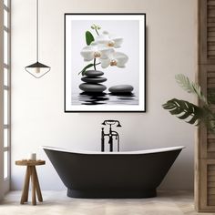 a bathroom with a black bathtub and white flowers