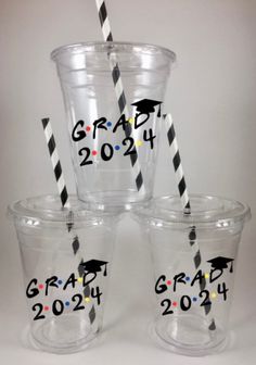 graduation cups with black and white striped straws