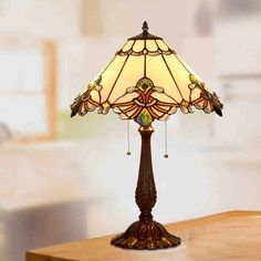 The body of this lamp is made of high quality glass and metal. Reminding you of the stained glass windows of a Gothic cathedral, this art lamp features a fancy Tiffany-style multi-colored glass shade. Adorned with flat butterfly wings at the base of the shade, this lamp is full of baroque beauty and nostalgic tones. Available in different colors, including burgundy, jade white and bright green.Perfect to spice your life when placed in your home, such as bedside, coffee table, or any personal spa Footstool Coffee Table, Gothic Cathedral, Minimalist Kitchen Design, Art Lamp, Contemporary Coffee Table, Room Setup, Tiffany Style, Dining Table Chairs, Stained Glass Windows