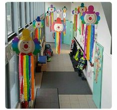 the hallway is decorated with colorful decorations and teddy bears hanging from the ceiling, along with other toys